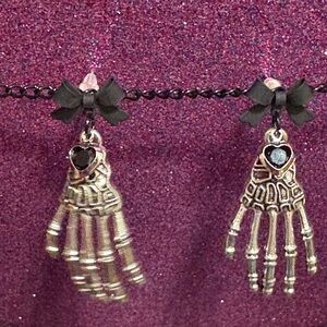 Skeleton Hand Earrings with Black Bow Accents